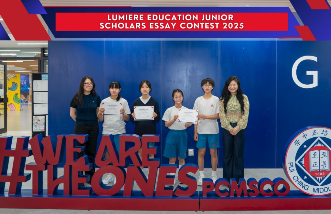 Students and adults at a Junior Scholars Essay Contest 2025 certificate presentation
